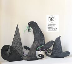 three halloween decorations sitting on top of a shelf