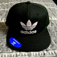 Excellent Condition. Never Used Black Casual Snapback Hat For Streetwear, Black Snapback Hat For Streetwear, One Size, Trendy Black Snapback Hat With Flat Bill, Black Snapback Hat Casual Style, Casual Black Snapback Hat, Casual Winter Snapback Hat For Streetwear, Trendy Black Flat Brim Baseball Cap, Classic Black Trucker Hat For Streetwear, Classic Black Visor Fitted Hat