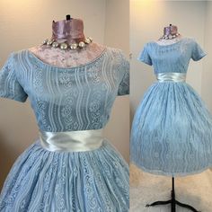 1950s dress / 50s dress / 1950s fit and flare / 1950s fit and flare  dress / 1950s fashion  This 1950s dress is stunning and has a gorgeous lace fabric on top of a shiny fancier which creates this matte shine. She has the classic fit and flare cut with the nipped waist, and a full skirt. She has a metal zipper in the back. Measurements provided are flat and have been doubled.  Bust 32"  Waist 26"  Hips free"   Length 38.5" Shoulders 13" ❤️ Condition: Excellent vintage condition. Flaw: The back o 1950s Style A-line Wedding Dress, Vintage Full Skirt Wedding Dresses, 1950s Style Fitted Tea Length Dress, Fitted Tea Length Dress In 1950s Style, 1950s Style Fitted Tea Length Vintage Dress, 1950s Style Fitted Tea-length Dresses, Vintage Knee-length Wedding Dress, Retro Full Skirt Wedding Dress, 1950s Style Blue Wedding Dress