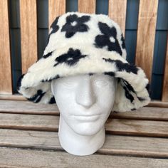 Party In Style This New Years And Keep Warm With This Soft Faux Fur Bucket Hat That Is White With Black Flowers! The Head Circumference Is About 22 Inches, And Has A Drawstring On The Inside. Never Worn. Trendy White Winter Bucket Hat, White Brimmed Bucket Hat For Winter, White Bucket Hat For Fall, White One Size Bucket Hat, Adjustable Brimmed Faux Fur Hat, White One Size Bucket Hat For Spring, Adjustable Faux Fur Brimmed Hat, White Wide Brim Mini Hat For Winter, White One-size Bucket Hat For Spring