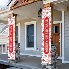 two red and white christmas banners are on the front porch of a house with snowflakes