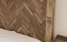 a wooden headboard made out of wood planks