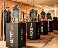 clothes and jackets are on display in the store's clothing section, which also includes denim jackets