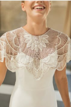 a woman in a wedding dress smiling