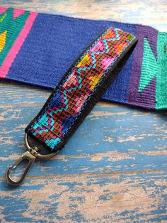 a colorful lanyard with a metal hook on it