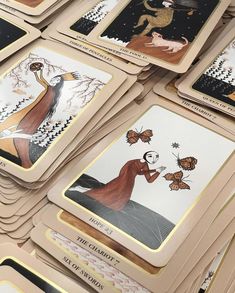 many playing cards are stacked on top of each other with images of women holding flowers