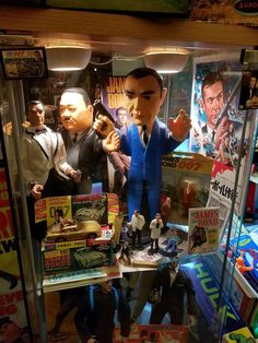 a display case filled with toys and action figures