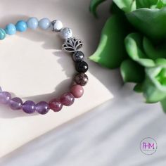 Introducing the Inner Wisdom Chakra Crystal Bracelet 🪷, a stunning piece that blends beauty and healing energy. This gorgeous bracelet features an array of genuine crystals, each carefully selected to align your chakras and promote balance. The silver lotus charm adds a touch of elegance, symbolizing purity and spiritual growth. Whether you’re seeking inner peace or simply looking to elevate your style, this bracelet is the perfect companion for your journey toward wellness and wisdom. Key Feat Silver Adjustable Crystal Bracelet For Meditation, Silver Gemstone Crystal Bracelet For Meditation, Silver Spiritual Crystal Bracelet For Healing, Holistic Silver Bracelets With Round Beads, Holistic Silver Bracelet With Round Beads, Holistic Crystal Bracelet With Gemstone Beads For Meditation, Spiritual Gemstone Beads Charm Bracelet, Mineral Crystal Bracelet With Stones For Healing, Spiritual Silver Beaded Bracelets With Stones