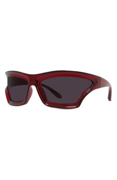 Curved lenses and logo-accented temples add visual intrigue to mask sunglasses designed in collaboration with the boutique Paula's Ibiza. 70mm lens width; 17mm bridge width; 115mm temple length 100% UV protection CR-39 lenses Injected plastic Made in Italy Modern Red Shield Sunglasses With Gradient Lenses, Modern Red Tinted Shield Sunglasses, Red Modern Shield Sunglasses With Uv Protection, Modern Red Shield Sunglasses With Uv Protection, Modern Red Polarized Shield Sunglasses, Red Modern Shield Sunglasses With Polarized Lenses, Modern Red Shield Sunglasses With Polarized Lenses, Red Cat Eye Sunglasses With Uva Protection, Mask Sunglasses