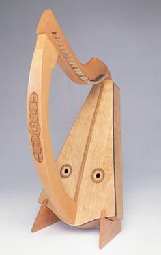 a wooden harp with two strings on it