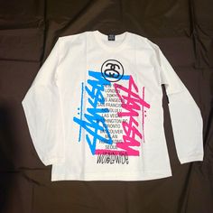 Stussy Worldwide Cities Tee. Deadstock Vintage. New Without Tags. Trendy White Tops With Graffiti Print, Trendy White Top With Graffiti Print, White Long Sleeve Top With Graffiti Print, Stussy 8 Ball Shirt, Stussy Tee Shirt, Vintage Stussy T Shirts, Stussy Dice Tee, Stussy Men, Stussy Basic Tee