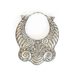 Handmade Miao silver necklace. This could be made of "bai tong" or white copper which is a cupro-nickel. Without doing proper tests it is virtually impossible to distinguish it from real silver. The material has been used in China by the Miao and others since around the 12th century by those whose status has not allowed them to use real silver. Miao are mountain-dwelling peoples of China, Vietnam, Laos, Burma, and Thailand * Width 11 1/4” * Length 7” * Length from neck band to bottom edge 14 3/4 Miao Silver, 12th Century, Not Allowed, Southeast Asia, Laos, Vietnam, Thailand, Silver Necklace, Copper