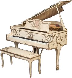 an ornately decorated grand piano with bench and stool in the foreground, isolated against a white background