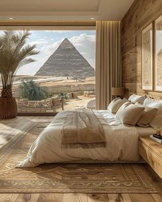 a large bed sitting in the middle of a bedroom next to a window with an egyptian pyramid on it