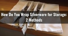 two napkins with silverware in them sitting on top of a table