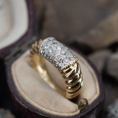 This intriguing 18K yellow gold ring features a fluted design and is accented with nineteen (19) round brilliant cut diamonds bead set into 18K white gold. The ring measures 8.2mm at the top, rises 4.3mm above the finger, tapering to 4.2mm wide and 1.2mm thick at the base of the shank. The ring is currently size 6.75. Bead Set, 18k Yellow Gold Ring, Yellow Gold Ring, Round Brilliant Cut Diamond, High Quality Jewelry, Modern Jewelry, Round Brilliant Cut, Brilliant Cut Diamond, Yellow Gold Rings