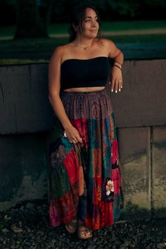 This Patchwork Maxi Skirt features an elastic, stretchy waistband, making it a comfortable and versatile piece for transitional seasons and travel. The unique pattern adds an element of exclusivity to the already sophisticated design. There may be variations among skirts since the fabrics are all different patchworks. Chic Patchwork Skirt, Relaxed Patchwork Skirted Bottoms, Chic Skirt With Patchwork Detail, Stretch Maxi Skirt With Elastic Waistband For Vacation, Versatile Relaxed Skirt For Vacation, Stretch Bohemian Skirt, Stretch Long Skirt For Vacation, Versatile Relaxed Fit Skirt For Vacation, Bohemian Black Midi Skirt