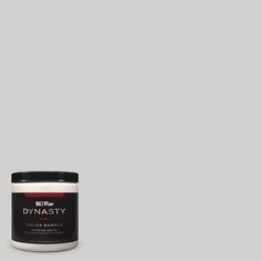 a can of dynastity paint on a gray background