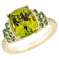 This collection features a selection of the most Olivia hue peridot gemstone. Uniquely designed this ring with tsavorite and diamonds in Yellow gold to present a rich and regal look. Peridot with Tsavorite and White Diamond Ring in 18 Karat Yellow Gold. Peridot: 3.67 carat, size: 10X8mm pear shape. Tsavorite: 0.28 carat, size: 1.60mm round shape. Diamonds: 0.11 carat, size: 1.50mm round shape G color, VS clarity. Gold: 4.748g, 18Karat yellow gold. R1684 Luxury Peridot Diamond Ring For Formal Occasions, Luxury Green Sapphire Ring With Gemstone Accents, Luxury Green Sapphire Ring With Accent Stones, Luxury Peridot Rings With Accent Stones, Luxury Yellow Gold Peridot Rings, Yellow Gold Peridot Rings With Gemstone Accents, Yellow Gold Peridot Ring With Center Stone, Yellow Gold Peridot Diamond Ring, Green Diamond Ring With Gemstone Accents For May Birthstone