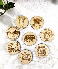 six wooden magnets that say home is where the wild things are and have been drawn on them