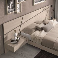 a bedroom with a bed, nightstands and pictures on the wall