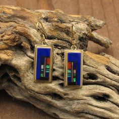 "Vintage 14K gold rectangle multi-stone inlay dangle earrings.  The artist is G. Nelson, their hallmark is stamped on the backside of the earrings.  The earrings are also stamped \"14K\".  The main stone within the inlay design is lapis, there is also a small amount of opal within the design.  The earrings measure 1 1/2\" long including the hook.  Thank you for shopping with us and please feel free to message us with any questions.   *The color on your screen may not reflect the actual stone col Modern Multi-stone Rectangular Jewelry, Gold Rectangular Multi-stone Jewelry, Rectangular Inlay Jewelry For Gifts, Southern Arizona, Inlay Design, Stone Inlay, Made Jewelry, Sterling Silver Cuff Bracelet, Tucson Az