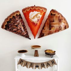 three pies are arranged on top of a table