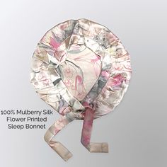 an image of a paper plate with flowers on it and the words'100 % mulberry silk flower printed sleep bonnet