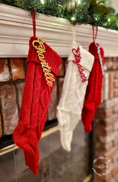 christmas stockings hanging from a mantel decorated with red, white and gold stocking