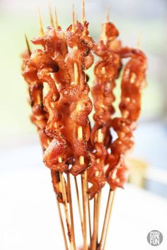 several skewered meats are on sticks with toothpicks sticking out of them