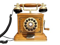 an old fashioned wooden phone with two dials