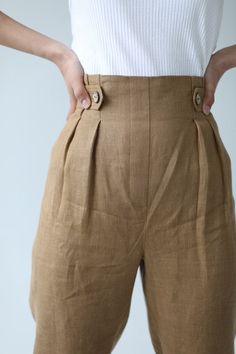 "Linen Pants IDA / Natural Linen Tapered Trousers / Women Linen Bottoms / Comfortable and Ethically Made by Happymade Designs WHAT MAKES US SPECIAL: Happymade is a Scandinavian social enterprise which hopes to change fashion by creating fair work opportunities for vulnerable women. Our clothes are handmade in sustainable fabric. Every item you purchase in our shop gives hope and future to a woman who would otherwise be struggling. Read more in About Us. Happy you, happy planet, happy woman who m