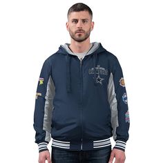 Officially Licensed NFL Cowboys Commemorative Reversible Hooded Jacket  Keep your team spirit alive during the colder months by rocking this Officially Licensed NFL Cowboys by Carl Banks Commemorative Reversible Hooded Jacket. One side has the Primary team color with secondary team color arm inserts. Embroidered commemorative championship applique left chest. Super Bowl championship appliques left sleeve. full back commemorative championship Embroidered applique with team logo. The other side has Secondary Team color with full team name and logo applique center chest. team helmet applique at left sleeve. team logo on back. Team Spirit Outerwear For Sports Season, Winter Team Spirit Fan Gear Outerwear, Sporty Hooded Outerwear For Game Day, Winter Varsity Jacket For Fan Gear With Team Spirit, Winter Varsity Jacket For Team Spirit, Winter Varsity Jacket For Fan Gear, Team Spirit Hooded Outerwear For Sports Season, Hooded Varsity Outerwear For Game Day, Collegiate Hooded Outerwear For Sports Events