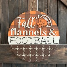 a wooden sign that says fall, flannes and football