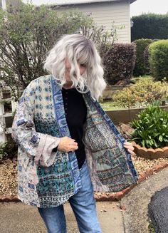 This is silk sari fabric made into kantha shawls and then the coat is made from the scarves. It is a Kimono style, exactly the same measurements as my plus size cotton kantha jackets.  This is one size and will fit anyone from a size 6 up to size 22(2x) Pockets on both sides. In the photos you can see the reverse side. Like having 2 jackets for the price of one.  33 inches long measuring back neck to hem. It measures 54 inches around the bust.  Truly a unique piece of art. I'm a size 8 and it looks beautiful on me because it drapes. However this will easily fit up to a size 22 This is one of a kind. Each one of my jackets is made from carefully curated silk kantha shawls. Designed by Lisa Finkelstein in Los Angeles.  Follow me on Instagram @leeza888clothing for more photos, video and info How To Make Kimono Jacket, Unique Plus Size Outfits, How To Make Kimono, Kantha Sari, Funky Pants, Kantha Jacket, Upcycled Clothes, Patchwork Shirt