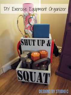 an exercise equipment organizer is displayed on the floor in front of a dresser and chair