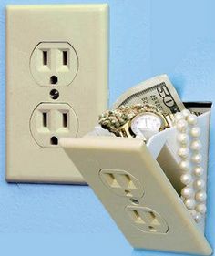 an electrical outlet with pearls and money in it