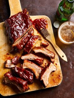 barbecue ribs with bbq sauce on a cutting board