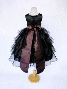 Beautiful organza ruffled dress tailor-made and ready to impress at any upscale event! Handcrafted with the upmost of care and attention to detail, we make sure that each dress is perfectly one of a kind for your little girl. Bridal satin top followed by a satin sash for a nice and snug fit Comes with a flower and matching colored sash. The skirt has layers of cut organza strips which are sewn onto the lining to create the ruffled effect The organza is then sewn at the edges to create those cris Sleeveless Organza Tutu Dress With Ruffles, Black Organza Evening Dress With Ruffles, Organza Pageant Dress With Ruffles For Dress-up, Deep Purple Flower Girl Dress, Organza Ruffle Dress, Black Tutu Dress With Ruffles For Dress-up, Newborn Flower, Toddler Flower Girls, Mannequin Dress