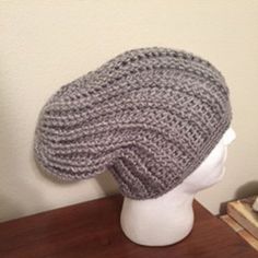 Men Handmade Crochet Slouchy Hat.  This beautiful handmade crochet slouchy hat was made with 100% acrylic yarn.  This hat is a great essential during the cooler weather. Made with a ribbed band, it has plenty of stretch making it comfortable enough for all day wear. * available colors: gray or navy blue. Hand Knitted Gray Crochet Hat One Size, Gray Hand Knitted Crochet Hat One Size, Gray One Size Yarn Beanie, Handmade Slouchy Crochet Hat In Acrylic Yarn, Slouchy Crochet Yarn Cap, Handmade Gray Crochet Hat, One Size, Slouchy Crochet Yarn Hat, Hand Knitted Gray Crochet Hat, Slouchy Handmade Crochet Hat In Acrylic Yarn