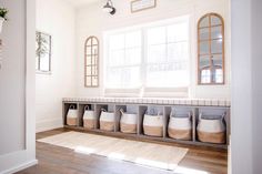 an image of a room with white walls and wooden floors