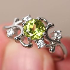 This is a gorgeous handmade creation. Its beauty is its simplicity & Elegance. The (6*6mm round cut natural peridot) is crafted in solid sterling silver / 14k gold. It is available to customized, if you have any mind, just let me know, we will discuss with it. All item is sent in a beautiful gift box You can realize more lovely stuff clicking the link https://www.etsy.com/shop/knightjewelry?refshopsection_shophome_leftnav Please leave the correct address and you PHONE NUMBER for delivering succe Wedding Ring Round, August Birthstone Ring, September Birthstone Rings, Green Amethyst Ring, Wedding Rings Round, Emerald Cut Engagement, Sapphire Wedding, August Birthstone, Engagement Ring Cuts