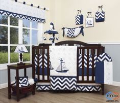 a baby crib bedding set with blue and white chevrons