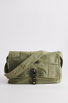 Classic look messenger bag with a flap top closure. Washed cotton bag with a secure latch closure front and rivet accents at the shoulder strap. Features Patched messenger bag Washed cotton bag Flap front Secure buckle down closure Shoulder strap Content + Care 100% Cotton Spot clean Imported | Patched Messenger Bag in Olive, Men's at Urban Outfitters Everyday Flap Satchel With Hasp Closure, Everyday Canvas Flap Bag With Adjustable Strap, Green Canvas Satchel With Adjustable Strap, Everyday Canvas Bag With Flap And Adjustable Strap, Everyday Canvas Bag With Adjustable Strap And Flap, Canvas Satchel With Snap Closure For Daily Use, Everyday Canvas Satchel With Snap Closure, Cotton Satchel With Adjustable Crossbody Strap, Daily Use Canvas Flap Bag