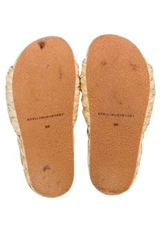 Elevate your vacation style with Stella McCartney's beige "Skyla" slide sandals. Made with comfortable raffia, these slides are perfect for your next tropical getaway. Pair them with denim shorts or a cute swim coverup for an effortless yet stylish look. Size 6 (36) Slide on Raffia upper Gold logo circle Platform 1.5" Toe to heel 9.75" Beige Closed Toe Slides For Beach, Beige Closed Toe Slides For The Beach, Beige Closed-toe Slides For The Beach, Beige Round Toe Slides For Vacation, Comfortable Beige Slides With Woven Sole, Beige Round Toe Slides For Beach, Beige Slides For Beach, Beige Round Toe Slides For The Beach, Cream Slip-on Slides For The Beach