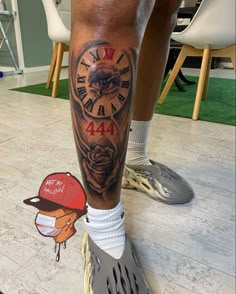 a man with a clock tattoo on his leg