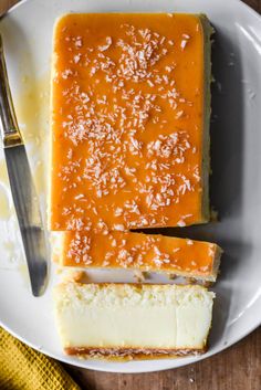 a piece of cheesecake on a plate with a knife