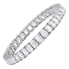 31 Exceptional Emerald Cut Diamonds set in one timeless bracelet, with 316.33 Carats of Emerald Cut Diamonds, each diamond is GIA Certified. D E F in Color ( colorless) VVS1-VVS2 in Clarity. Diana M. is a leading supplier of top-quality fine jewelry for over 35 years. Diana M is one-stop shop for all your jewelry shopping, carrying line of diamond rings, earrings, bracelets, necklaces, and other fine jewelry. We create our jewelry from gemstones and diamonds of the highest quality (GIA certified Bracelets Tennis, White Diamond Jewelry, Bridal Diamond Necklace, Bling Ideas, Platinum Bracelet, Bracelet Tennis, Vintage Tennis, Modern Bracelets, David Webb