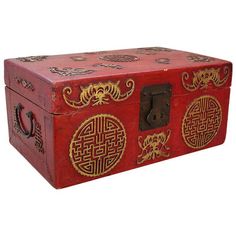 a red box with gold designs on it