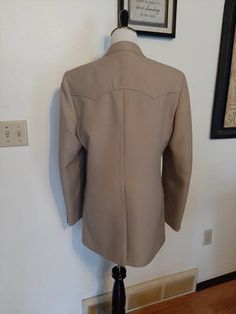 "Mid Century Mens Tan Rockabilly Lined Levis 40 L Sport Coat/Blazer Excellent Vintage Condition. Shows No Wear. No Rips Or Tears. Very Clean, Has 4 Sets Very Tiny Pin Holes Where The Label/Tag Was Attached To Left Sleeve Bottom. Very Light Stain On Right Lapel. Made By Levis Western Wear, San Francisco, CA. Marked Size 40 L Tan/Beige/Khaki Color Polyester Or Wool Blend Beige Acetate Satin Lining Fabric Double Stitch Top Stitching Western Yokes/Pocket Flaps 2 Lining Pockets 2 Brown/Tan Buttons In Fitted Vintage Khaki Blazer, Fitted Vintage Khaki Sport Coat, Fitted Khaki Sport Coat, Chenille Quilt, Mens Western Wear, Mens Western, Coverall Jumpsuit, 80s Mens, Mens Sport Coat